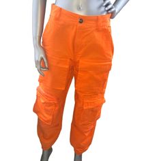 Orange Cargo Pants. Brand New. Size M Casual Mid-rise Orange Bottoms, Orange Cargo Pants For Summer, Orange Summer Cargo Pants With Pockets, Stretch Orange Pants With Pockets, Orange Stretch Pants With Pockets, Orange Stretch Bottoms With Pockets, Stretch Orange Bottoms With Pockets, Trendy Orange Pants With Pockets, Denim Jogger Pants