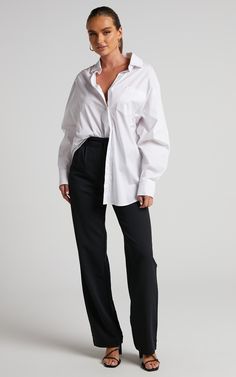 Introduce the Lorcan High Waisted Tailored Pants to your weekday wardrobe! These incredibly timeless and versatile pants will be your go-to pant for each and every occasion. They feature a high rise waist, tailored straight legs, side slip pockets and dart pleats. They're perfect for work and beyond, and can be dressed up or down depending on your vibe. Style it for work with the Terah Shirt in White and heeled sandals or for a casual day out with a baby tee and chunky sneakers!Product Details Relaxed Fit Wide-leg Dress Pants For Workwear, Timeless Wide-leg Office Pants, Casual Wide Leg Pants With Straight Hem For Office, Classic Relaxed Fit Wide Leg Pants For Business Casual, Timeless Straight Pants For Business Casual, Timeless Business Casual Straight Pants, Timeless High-waisted Pants For Work, Classic Relaxed Fit Bottoms For Work, Chic Workwear Bottoms With Straight Hem