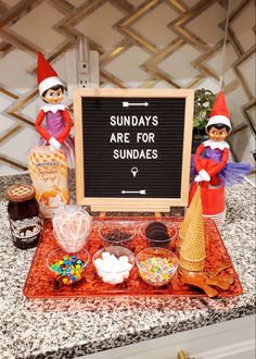 there is a sign that says sunday's are for sundaes on the counter