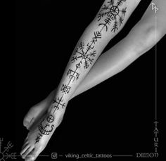 a woman's arm with tattoos on it and the words written in black ink