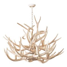 a white chandelier with antler branches hanging from it's center point