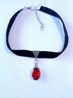 Ruby red black velvet Choker necklace Silver necklace Victorian necklace Bohemian necklace red pendant Vintage necklace Antique Gothic Choker necklace her gift  Victorian necklace . Bohemian necklace . Beautiful silver-tone Antique style ornaments and Ruby red  glass faceted oval crystal cabochon on silver toned pendant and black velvet choker necklace . Silver tone red pendant Victorian style necklace . Boho necklace. Bohemian necklace . Romantic necklace. Beautiful necklace with Ruby red penda Adjustable Red Gothic Jewelry, Red Clavicle Chain Choker, Red Choker Jewelry For Valentine's Day, Red Choker For Valentine's Day, Red Metal Choker Jewelry, Red Metal Choker For Party, Vintage Necklace Antiques, Gothic Choker Necklace, Black Velvet Choker Necklace