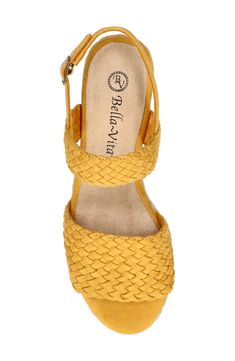 A braided jute wedge and woven detailing play up the textural delight of this elegant espadrille-inspired sandal secured by an adjustable slingback strap. 2" heel Cushioned footbed Textile upper and lining/rubber sole Imported Spring Braided Wedge Sandals With Round Toe, Spring Woven Leather Wedge Sandals, Spring Woven Leather Wedge Sandals With Straw, Spring Woven Leather Sandals With Wedge Heel, Spring Woven Leather Straw Wedge Sandals, Spring Braided Heels With Round Toe, Woven Synthetic Wedge Sandals, Summer Beach Braided Heels, Braided Heels For Summer Beach Occasions