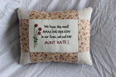 an embroidered pillow that says we have the most amazing person in our lives, we call her aunt kate