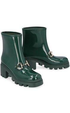 Golden horsebit hardware pays tribute to Gucci's equestrian heritage on this glossy rubber rain boot grounded by a chunky lugged sole to enhance traction.Waterproof: protects against rain, puddles and slush to keep feet dry in wet conditionsPull-on styleSynthetic upper, lining and soleDimensions: 2.5" heel; 1" platform 6" shaft100% Rubber, 100% Fabric, 100% DemetraMade in ItalyRuns narrow; order next size up. Shoes Runway, Chevron Outfit, Chevron Jewelry, Luxury Designer Shoes, Gucci Shop, International Clothing, Gucci Horsebit, Amina Muaddi, Luxury Women Fashion