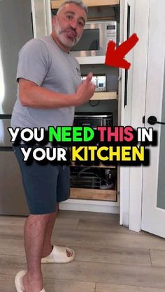 a man standing in front of an open refrigerator with the words you need this in your kitchen