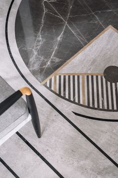 a black and white marble floor with an abstract design