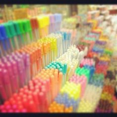 many different colored toothbrushes lined up together