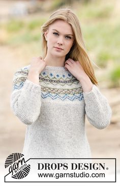 a woman wearing a sweater and holding her hand on her shoulder with the words drops design