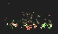 fireworks and flowers are lit up in the night sky with green, orange and red lights