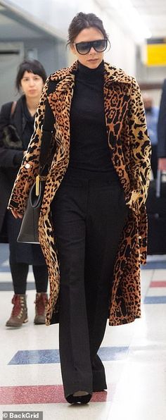 Victoria Beckham shows off her wild side in £2.5k leopard print coat and flares as she jets into NYC | Daily Mail Online Leopard Outfit, Beckham Style, Laura Bailey, Leopard Print Outfits, Leopard Outfits, Poppy Delevingne, Leopard Print Coat, Stylish Winter Outfits, Animal Print Fashion