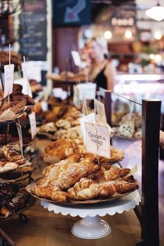 an assortment of baked goods on display at a bakery