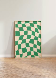 a green and white checkerboard pattern is on the wall in an empty room