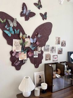 there are many butterflies on the wall