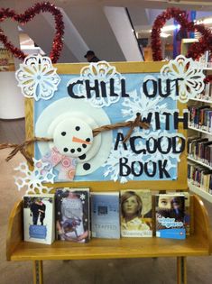 a sign that says chill out with a good book in front of some bookshelves