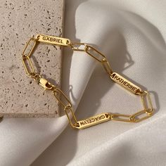 Introducing the Multiple Name Bracelet -- stunning and sophisticated, yet subtle and effortlessly cool. With its distinctive simplicity, this personalized necklace complements any style while still making a timeless statement. Personalize it for yourself or as a special gift for someone special in your life! Make occasions like birthdays, anniversaries, graduations, Mother's Day or Christmas special by gifting them this one-of-a-kind treasure they will cherish for years to come ► PRODUCT INFORMA Affordable Personalized Gold Chain Bracelet, Minimalist Metal Bracelets For Mother's Day, Personalized Gold Name Bracelet With Adjustable Chain, Modern Gold Name Bracelet For Gift, Modern Gold Name Bracelet As Gift, Elegant Nameplate Bracelet With Adjustable Chain, Elegant Adjustable Chain Paperclip Bracelet As A Gift, Elegant Adjustable Paperclip Bracelet As Gift, Elegant Adjustable Paperclip Bracelet For Gift