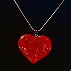 "This is a beautiful resin heart shaped pendant or it could be a charm or key chain....whatever your preference.  It is made from red resin with red glitter on the front of the heart.  On the back it says be mine.  This would be a great gift for Valentine's Day for your significant other.  It is 1-3/4\" X 1-1/4\".  It has a gold (plated) 20 Inch chain.  If you would rather have it as a key chain for your male partner, I can replace the necklace chain with a gold key ring, just let me know when you order it.  It will ship from Hixson, TN by 1st. class mail.  Thank you for shopping at Critters-R-Us :o)" Handmade Red Heart Necklace For Valentine's Day, Resin Heart Charm Pendant Jewelry, Red Heart Charm Necklace For Gift, Red Heart Necklace For Gifts, Red Heart Necklace For Gift, Red Heart Pendant Necklace Gift, Personalized Red Heart Pendant Necklace, Red Heart Cut Necklace For Gift, Heart Beads Resin Jewelry Gift