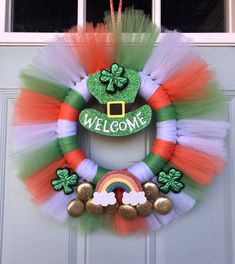 a st patrick's day wreath is hanging on the front door