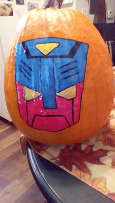 a pumpkin decorated with an iron man face