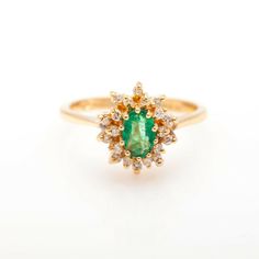 Set With A Clean 1ct Colombian Emerald And .50ct In Si H Diamonds. Nice 1.50cts Cocktail Ring And Retail Is $3000. Gorgeous. Stone: Emerald & Diamond Metal: 14 Kt Yellow Gold Ring Size: 6.25 Gram Weight: 3.5 Grams Diamond Cluster Ring With Brilliant Cut For May Birthstone, May Birthstone Diamond Cluster Ring With Brilliant Cut, Elegant Cluster Diamond Ring For May Birthstone, Elegant Cluster Ring With May Birthstone, Cluster Emerald Ring With Center Stone For Gift, Cluster Emerald Ring With Center Stone As Gift, Elegant Cluster Emerald Ring As Gift, Gift Cluster Emerald Ring With Center Stone, Elegant Cluster Diamond Emerald Ring