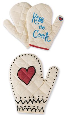 two oven mitts that say kiss the cook and one has a heart on it