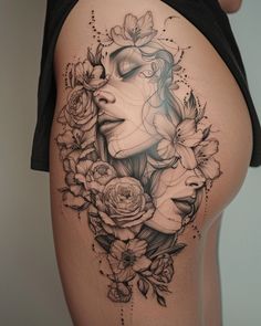 a woman's thigh with flowers on it