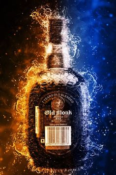 a bottle of old monk on fire and water with the word old monk printed on it