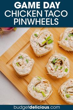 game day chicken taco pinwheels on a cutting board with text overlay