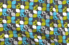 an image of a blue and green pattern on a gray background with white, yellow, and