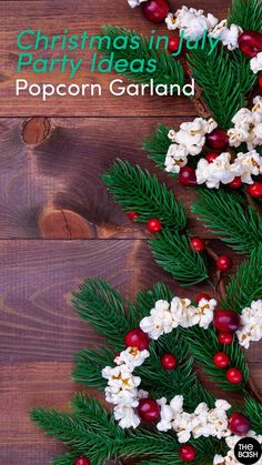 christmas party ideas popcorn garland with holly and cranberries on wooden background, text reads christmas party ideas popcorn garland