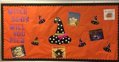 a bulletin board decorated with books and witch's hat for halloween time on an orange background