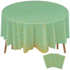 a green table cloth with gold dots on it