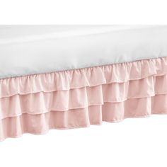 a pink bed skirt with ruffled edges