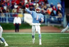 a football player throwing a ball during a game