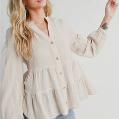 The Tiered Rustic Blouse With A Button-Down Front And Long Sleeves Exudes A Charming And Laid-Back Appeal. The Tiered Design Adds A Touch Of Bohemian Flair, Creating A Flowy And Relaxed Silhouette. The Rustic Aesthetic Lends A Vintage And Earthy Vibe To The Blouse, Making It A Versatile Piece For Both Casual And Semi-Formal Occasions. The Button-Down Feature Allows For Adjustable Styling Options, Whether You Choose To Wear It Open For A More Casual Look Or Buttoned Up For A Polished Appearance.