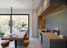 an open kitchen and dining room with sliding glass doors