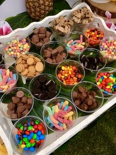 a tray filled with lots of different types of candies on top of a table