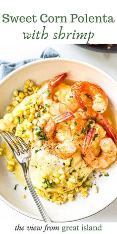 a white plate topped with shrimp and corn