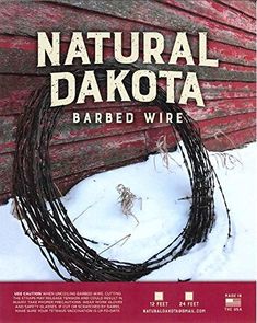 natural dakota barbed wire is shown in front of a red barn with snow on the ground