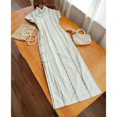 Step into the sunshine with this adorable cotton Qipao! Features delicate blue floral stripes that cascade gracefully down the length of the dress, creating a visually captivating and elongating effect. Made from 100% cotton, this Qipao is lightweight and breathable, making it the perfect choice for warm summer days. Whether you're attending a summer garden party or a casual day out, the Wen Yi 文艺 Literary 1930s Qipao is sure to turn heads! The charming floral pattern adds a cute and playful tou Sustainable Wardrobe, Modern Hanfu, Summer Garden Party, Qipao Dress, New Chinese Style, New Chinese, Plus Size Wedding, Floral Stripe, Summer Garden