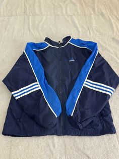 Vintage Adidas Track Jacket Athletic Full Zip Blue Windbreaker Size Large. Condition is in good pre owned. Check all pics for measurements. Blue Adidas Windbreaker For Sports, Blue Adidas Sports Windbreaker, Adidas Blue Track Jacket For Streetwear, Vintage Blue Outerwear For Sports, Vintage Blue Long Sleeve Track Jacket, Blue Long Sleeve Sport Coat, Blue Adidas Sporty Windbreaker, Adidas Blue Sporty Windbreaker, Sporty Blue Adidas Windbreaker