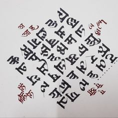 the letters are written in black and red ink on white paper with writing underneath them