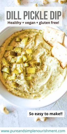 a white bowl filled with hummus and pickle dip