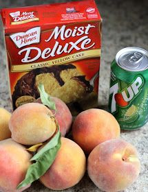 some peaches are sitting next to a can of soda and two cans of cake