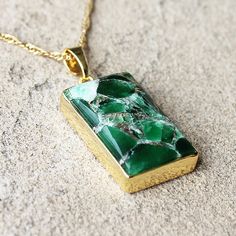 "This gorgeous dark green copper Turquoise rectangular birthstone pendant charm is surrounded by 18K Gold. Purchase the charm separately or with your choice of chain. Optional matching earrings at additional cost Stone: Turquoise Colour: Dark Green Birthstone: December Main Stone Size: 2.6cm high x 1.7cm wide Metal: 18K Gold Plated CHAIN Chain: 18K Gold Plated - Choose from 3 designs - Paperclip, Box or Figaro - all 18\" Length     - 18K Gold Filled 3mm PaperClip Chain     - 18K Gold Filled 1mm Link Figaro Chain      - 18K Gold Filled 1mm Box Chain  All gemstones are natural gemstones with inclusions. Each piece arrived beautifully packaged in a sturdy box, ready for gift giving or safe keeping. Gift wrapping can be selected as an add-on. I love making beautiful, handmade one-of-a-kind pie Spiritual Rectangular Jade Jewelry, Gold Oblong Gemstone Jewelry, Gold Plated Rectangular Gemstone Jewelry, Gold Plated Gemstone Jewelry In Rectangular Shape, Emerald Rectangular Pendant Necklace For May Birthstone, Gold Jewelry With Rectangular Polished Stone, Gold Jewelry With Polished Finish And Rectangular Stone, Handmade Yellow Gold Rectangular Jewelry, Gold Jewelry With Rectangular Stone For Gift