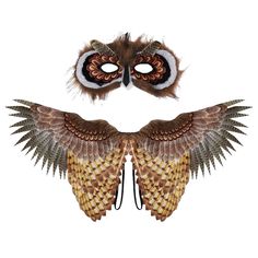 an owl mask with feathers attached to it