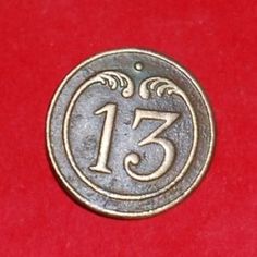 a coin with the number thirteen on it