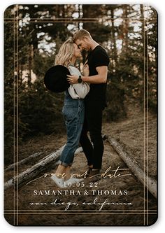 an image of a couple kissing in the woods for their wedding announcement card or save the date magnet