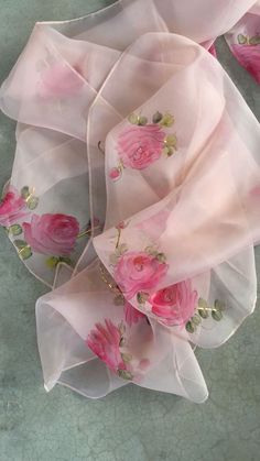 pink roses on white sheer chiffon fabric with gold trim and sequins