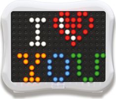 a close up of a game board with many different colored dots on it's surface